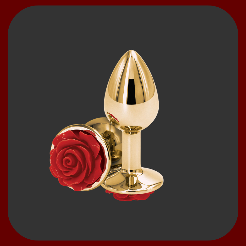 Luxusní anální kolík ze zlatého hliníku s červeným drahokamem ve tvaru růže, vhodný pro smyslnou a elegantní intimní stimulaci.