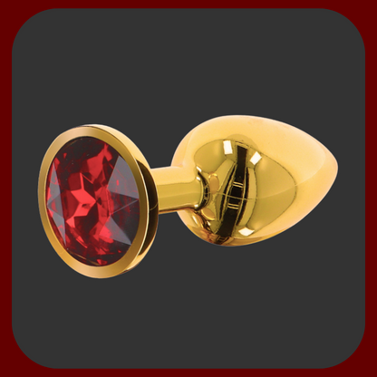 Zlatý anální kolík s červeným drahokamem na základně – elegantní erotická pomůcka v luxusním provedení, dostupná ve třech velikostech.