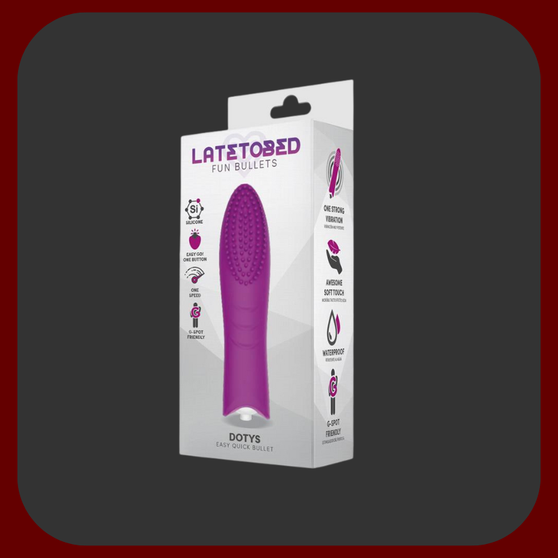 Fialový mini vibrátor Dottie Touch s jemnými silikonovými štětinkami a kompaktní velikostí pro diskrétní potěšení kdykoliv a kdekoliv.