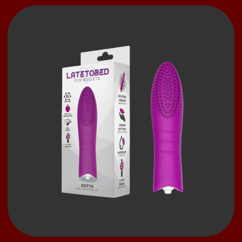 Fialový mini vibrátor Dottie Touch s jemnými silikonovými štětinkami a kompaktní velikostí pro diskrétní potěšení kdykoliv a kdekoliv.