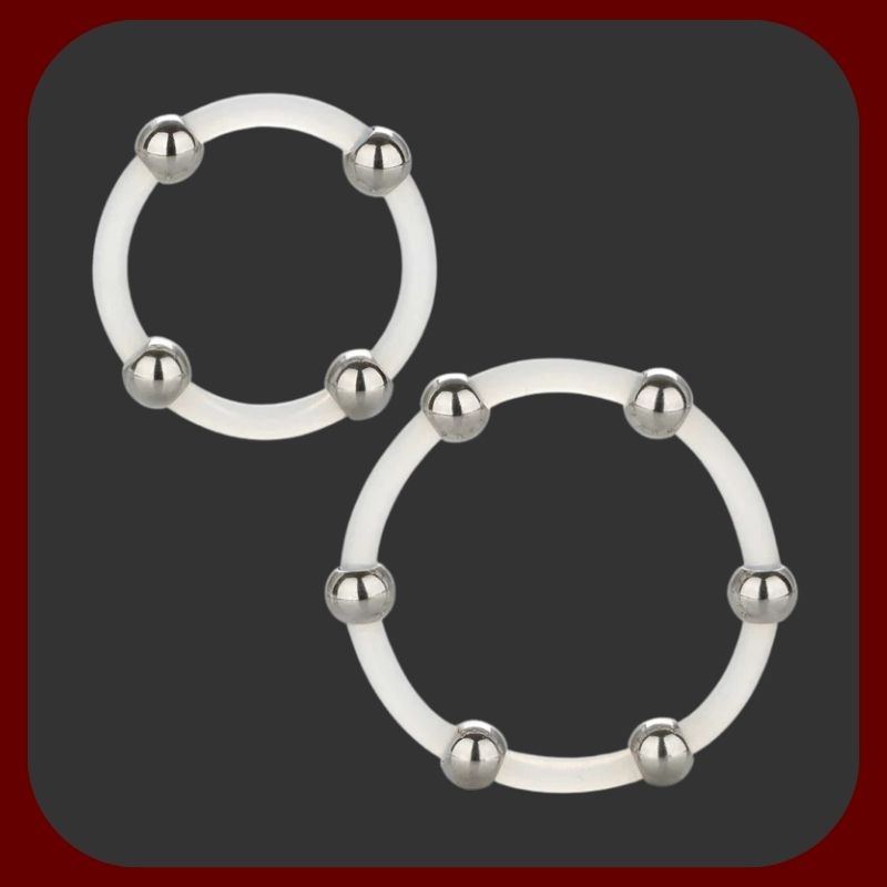 Dva průhledné silikonové erekční kroužky s nerezovými kuličkami od CalExotics – pro silnější erekci a lepší stimulaci.