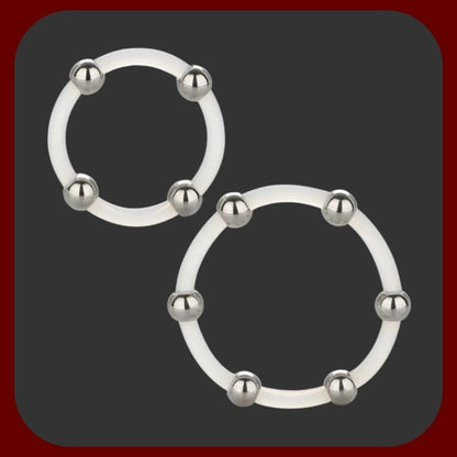 Dva průhledné silikonové erekční kroužky s nerezovými kuličkami od CalExotics – pro silnější erekci a lepší stimulaci.