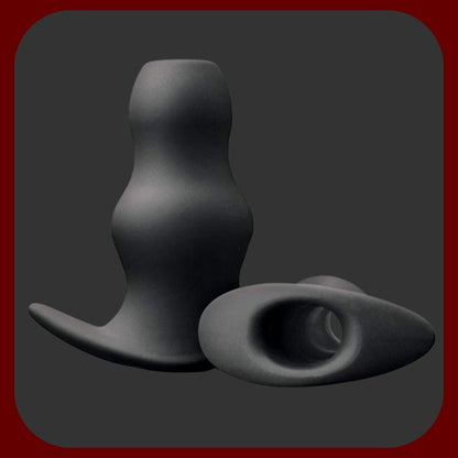 Černý silikonový anální tunel Renegade Peeker s dutým středem a ergonomickým vlnitým tvarem, délka 7,5 cm, průměr 3,5 cm pro intenzivní stimulaci.