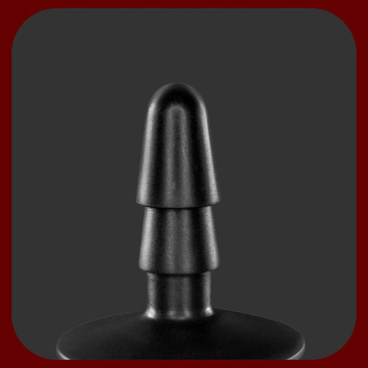 Černý adaptér s přísavkou kompatibilní se systémem VAC-U-LOCK, určený pro dilda a postroje.